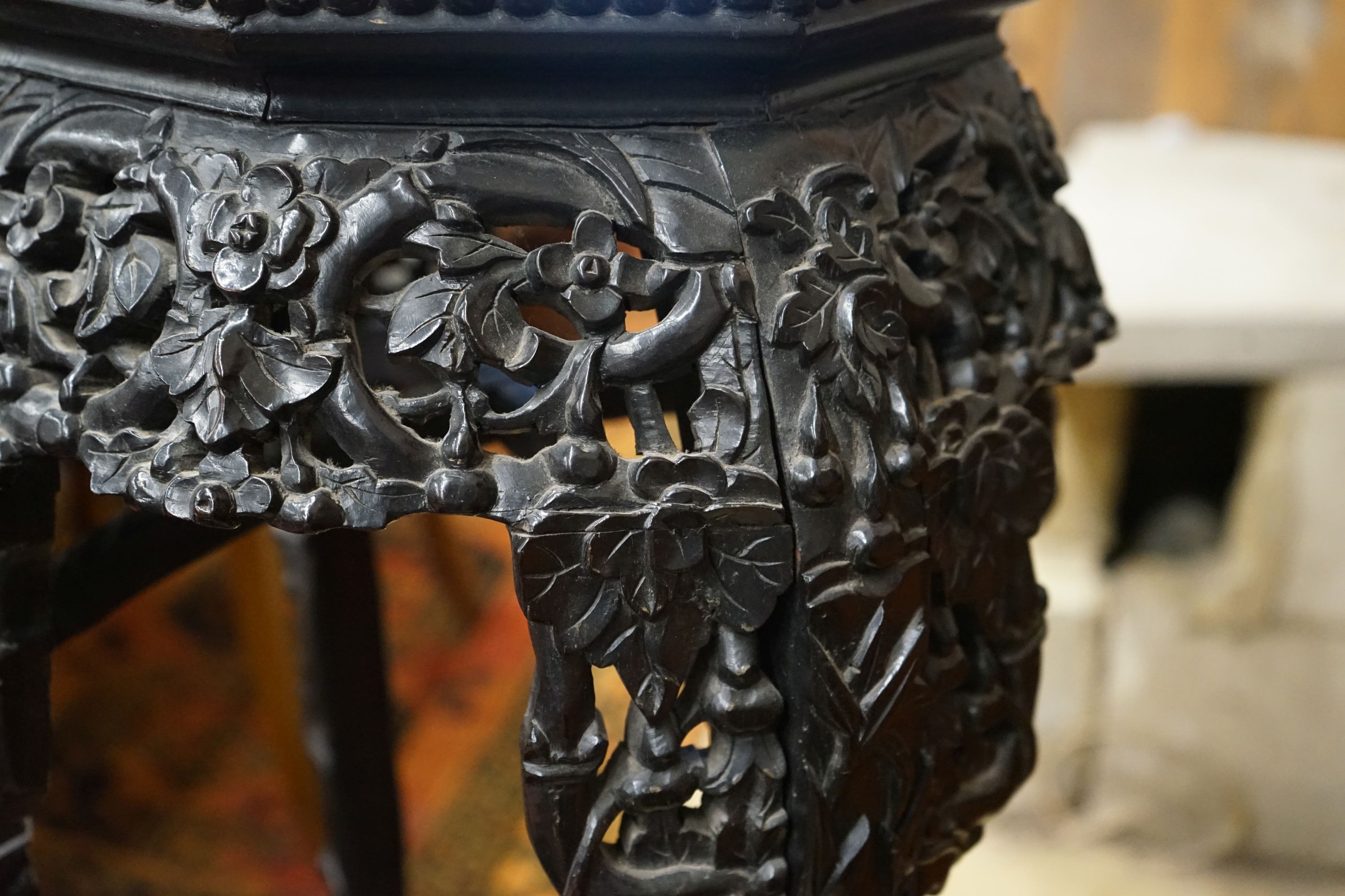 A Chinese carved hardwood marble top octagonal vase stand, width 40cm, height 90cm